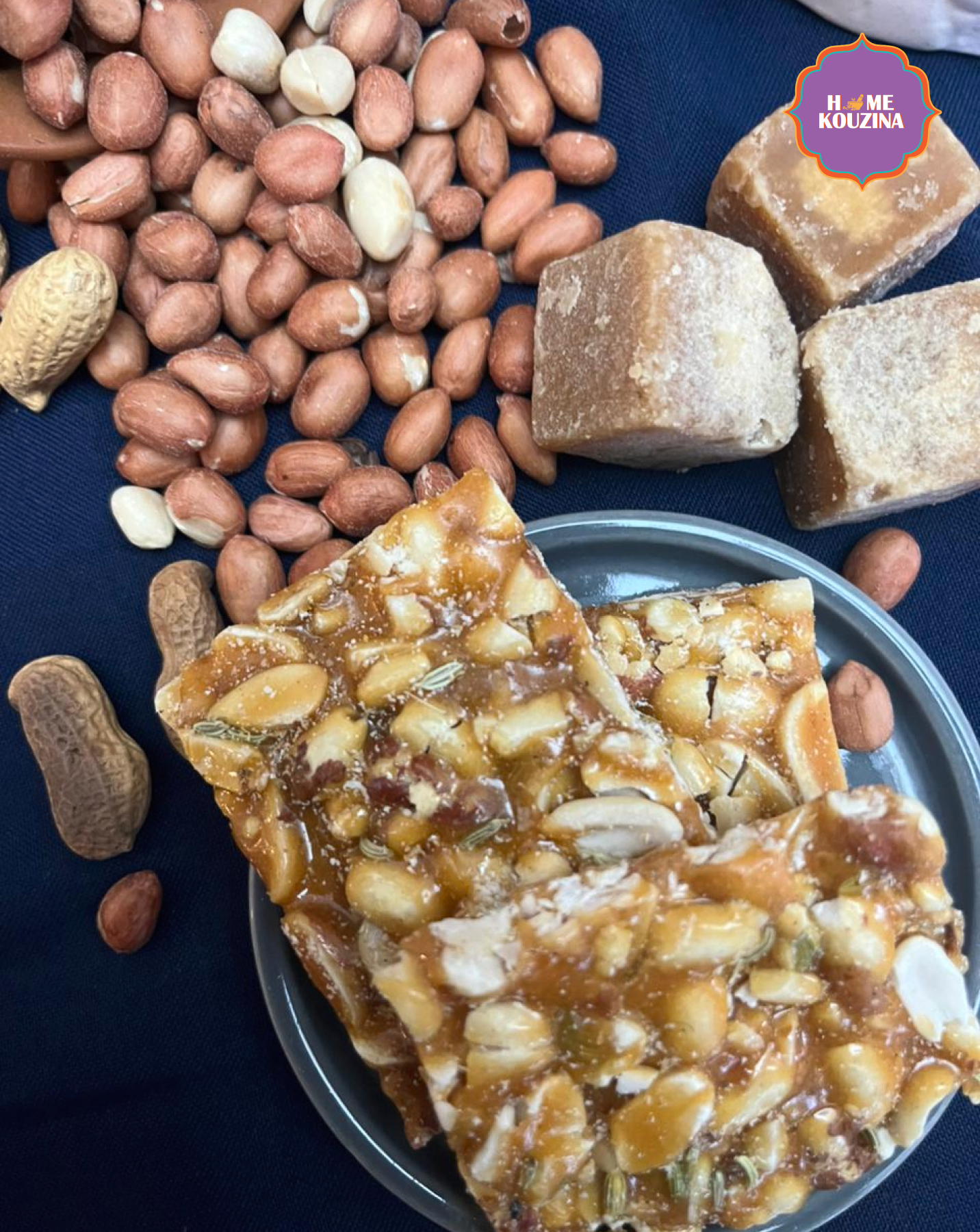 Nuts and a dessert on a plate with 'Home Kouzina' branding.