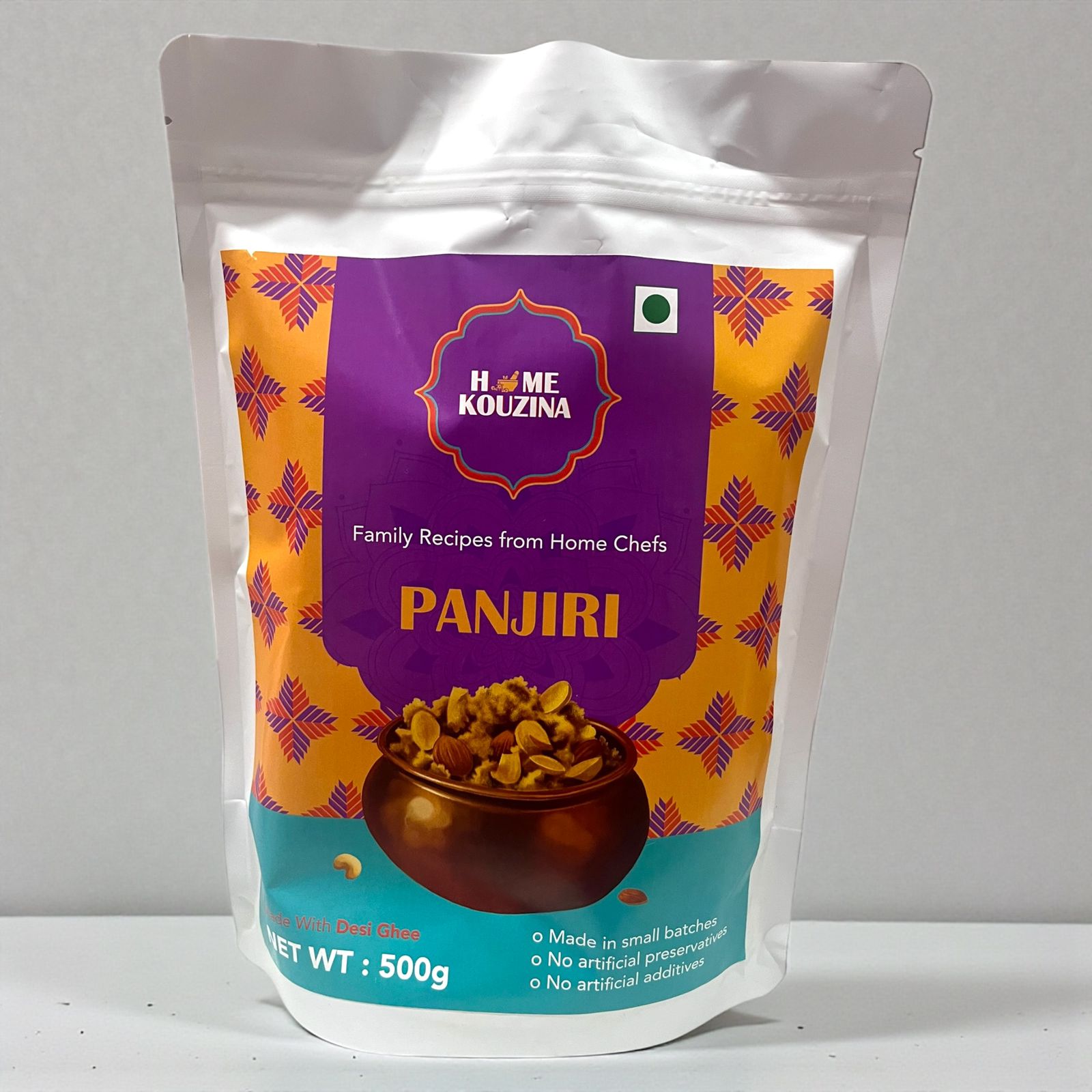 Packaged food item with 'Home Kouzina' branding on a gray background