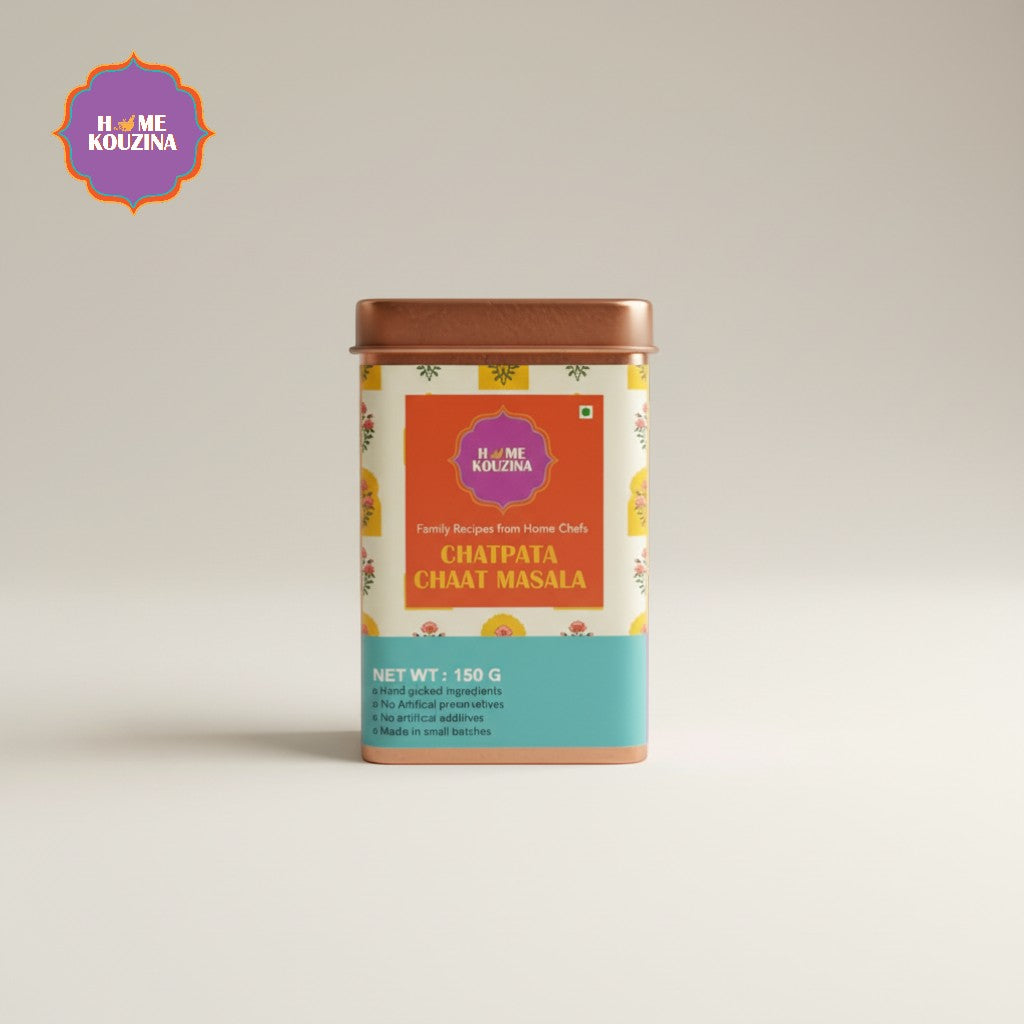 Tin of Chatpata Chat Masala with Home Kouzina branding on a light beige background