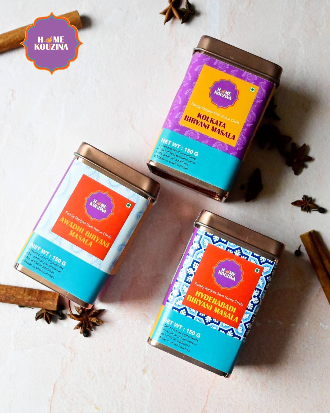 Home Kouzina Iryanis of India Premium Tin Pack flatlay with Awadh, Hyderabad, and Kolkata biryani masalas – authentic Indian spice blend set for festive meals and gifting