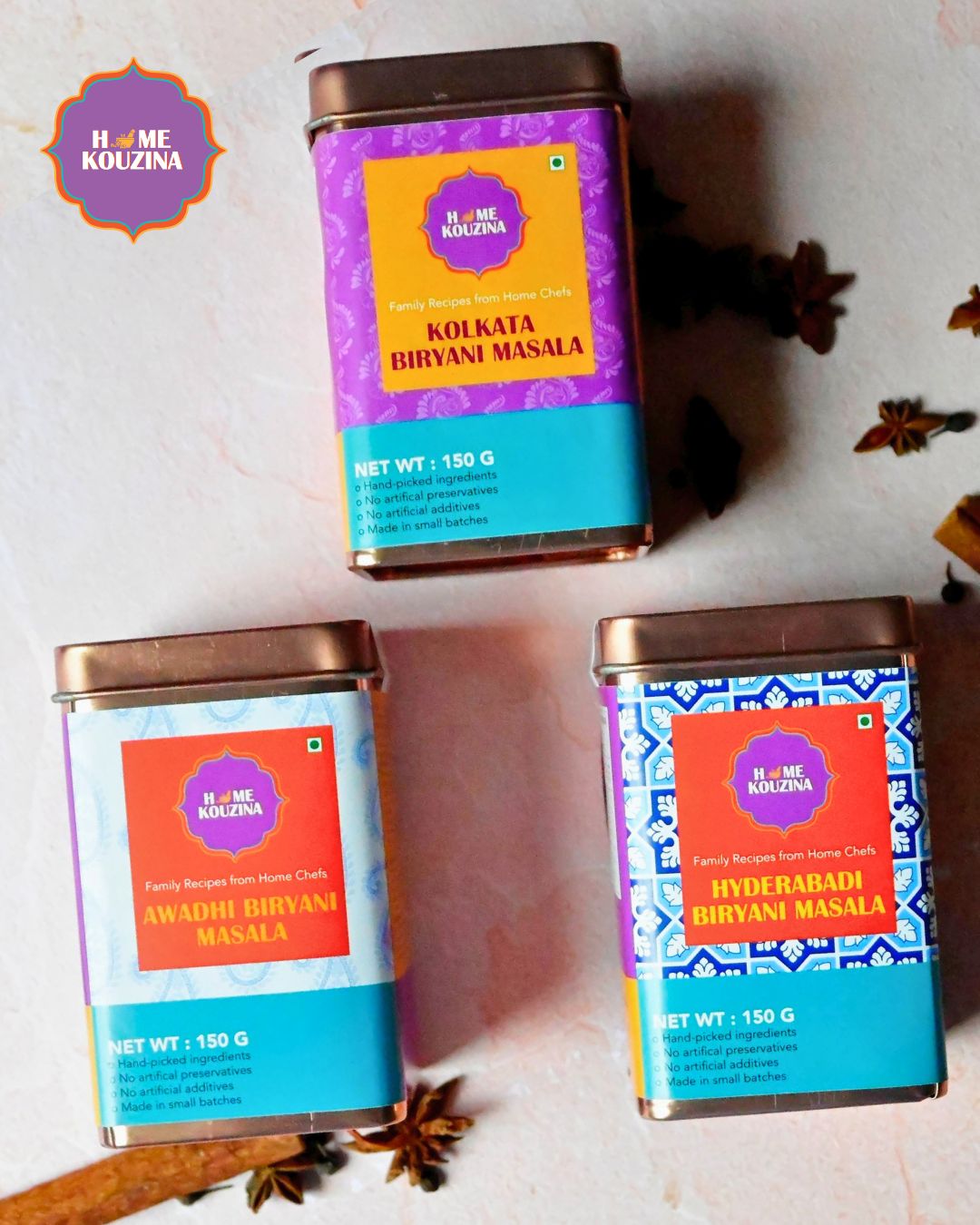 Top view of Iryanis of India Premium Tin Pack with three biryani masala tins arranged in an open gift box – authentic small-batch spices from Lucknow, Hyderabad, and Kolkata