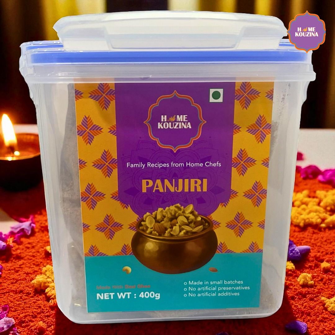 Home Kouzina Panjiri 350g in free airtight box with diyas, flowers, and festive decor in the background, ideal for Diwali gifting