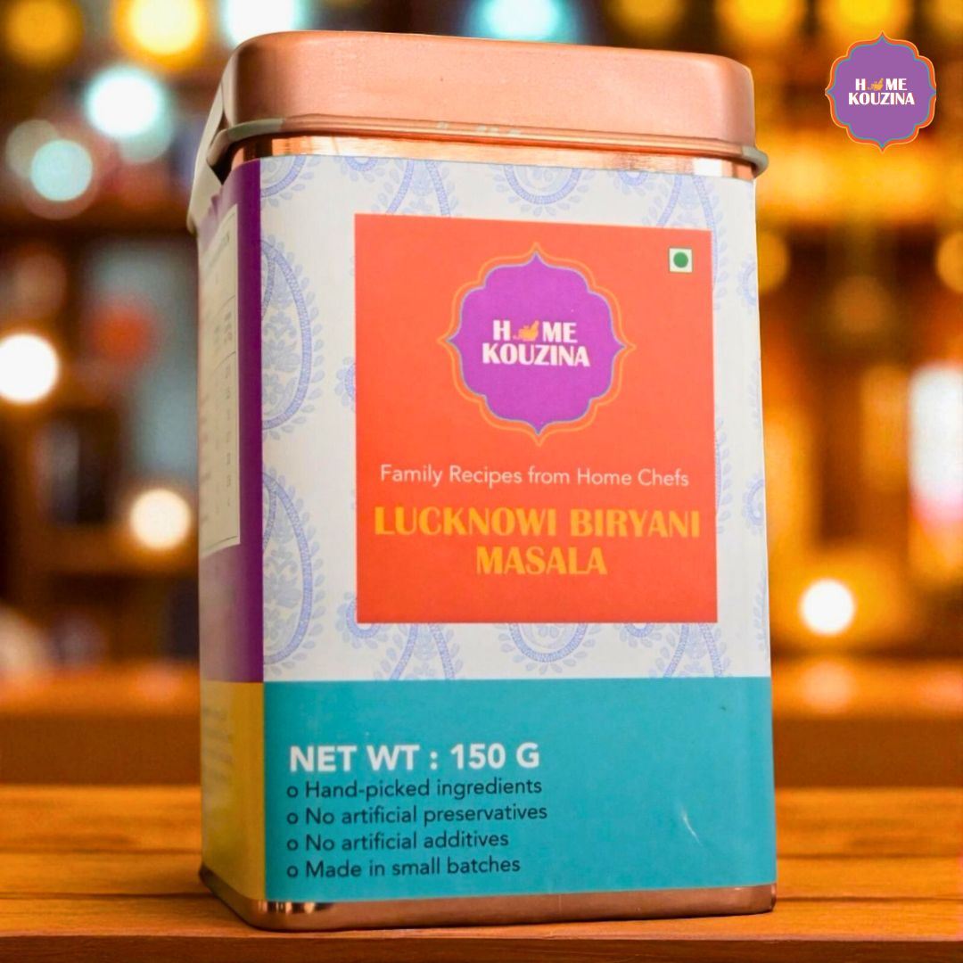 Front view of Home Kouzina's Lucknowi Biryani Masala tin on a rustic wooden table