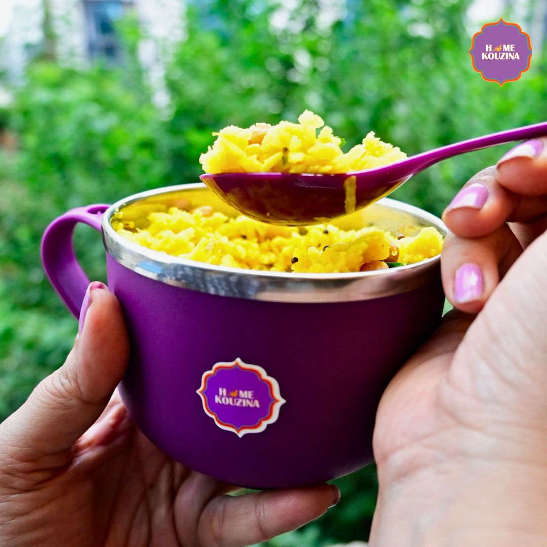 Home Kouzina Ready-to-Eat Poha served in a travel bowl with spoonful lifted, RTE pack visible outdoors – traditional Indian breakfast ready in minutes