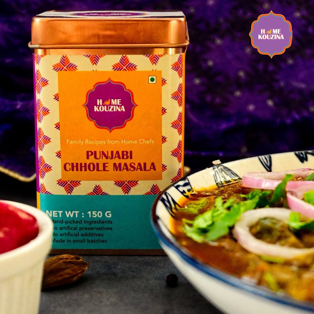 Front view of Home Kouzina Punjabi Chhole Masala 150g tin with bowl of rich, saucy Punjabi chhole – traditional North Indian curry spice