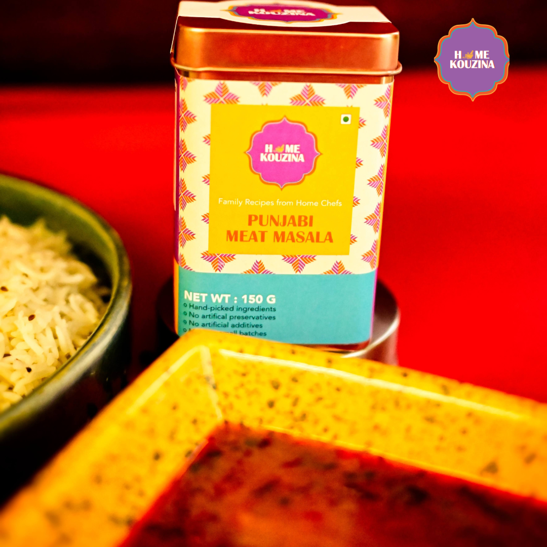 Home Kouzina Punjabi Meat Masala 150g tin in front of bowl of rich meat gravy – handcrafted North Indian spice blend for restaurant-style curry at home
