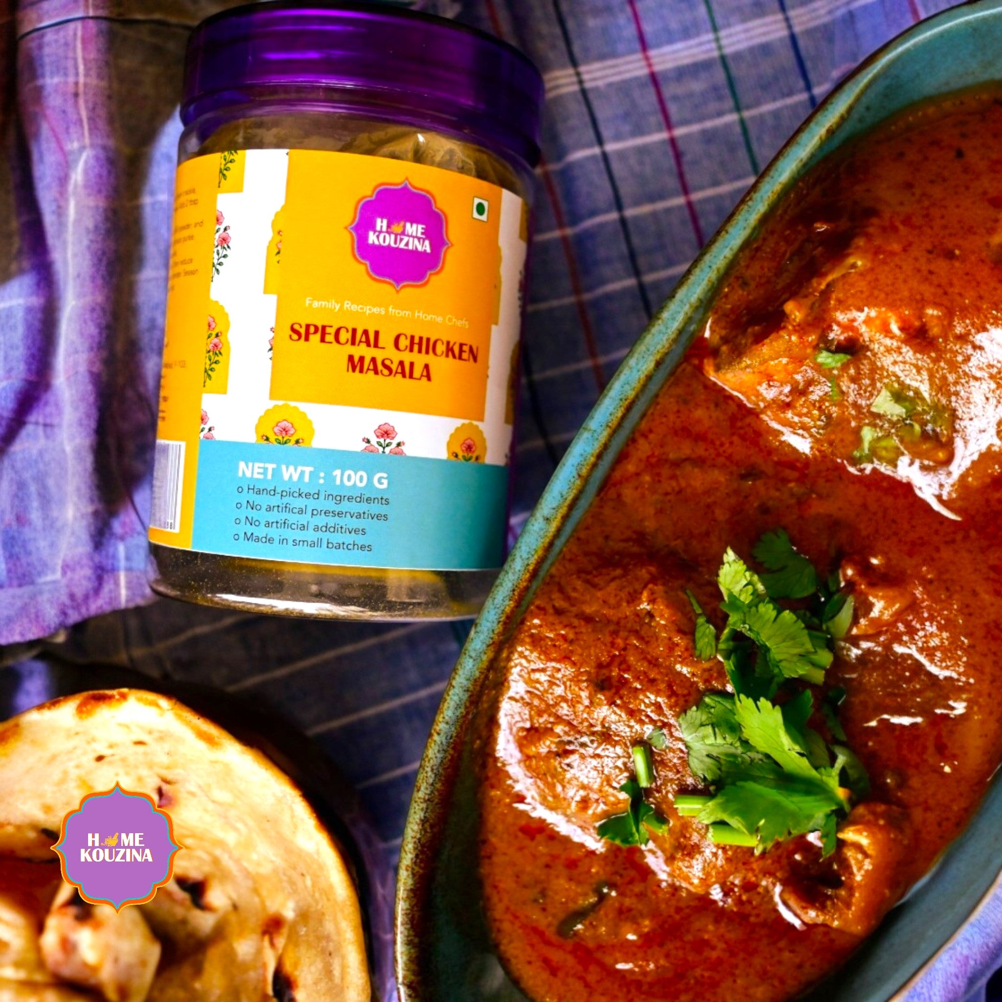 Kouzina Special Chicken Masala jar with a bowl of chicken curry and naan bread.