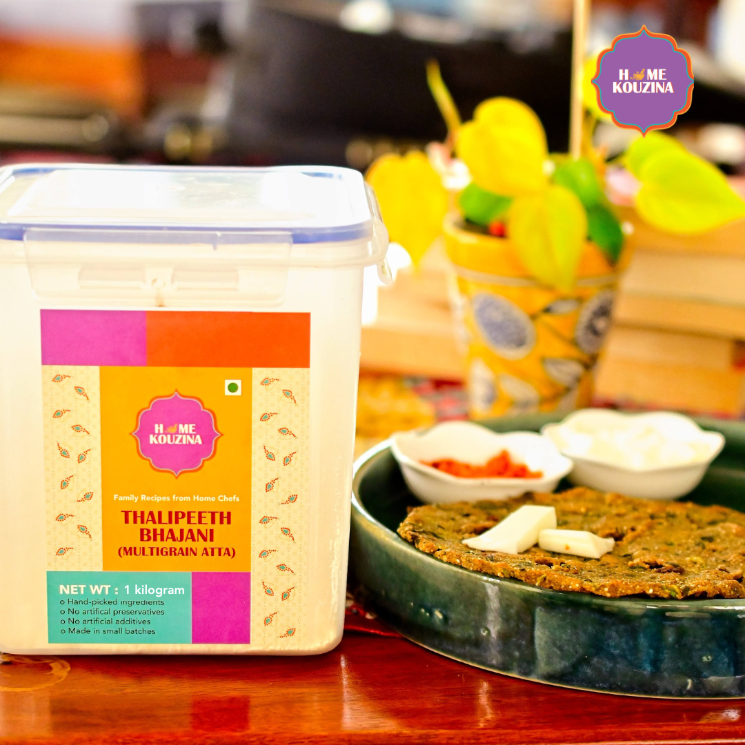 Front view of Thalipeeth Bhajani 1kg box with thalipeeth placed next to it, ready to serve