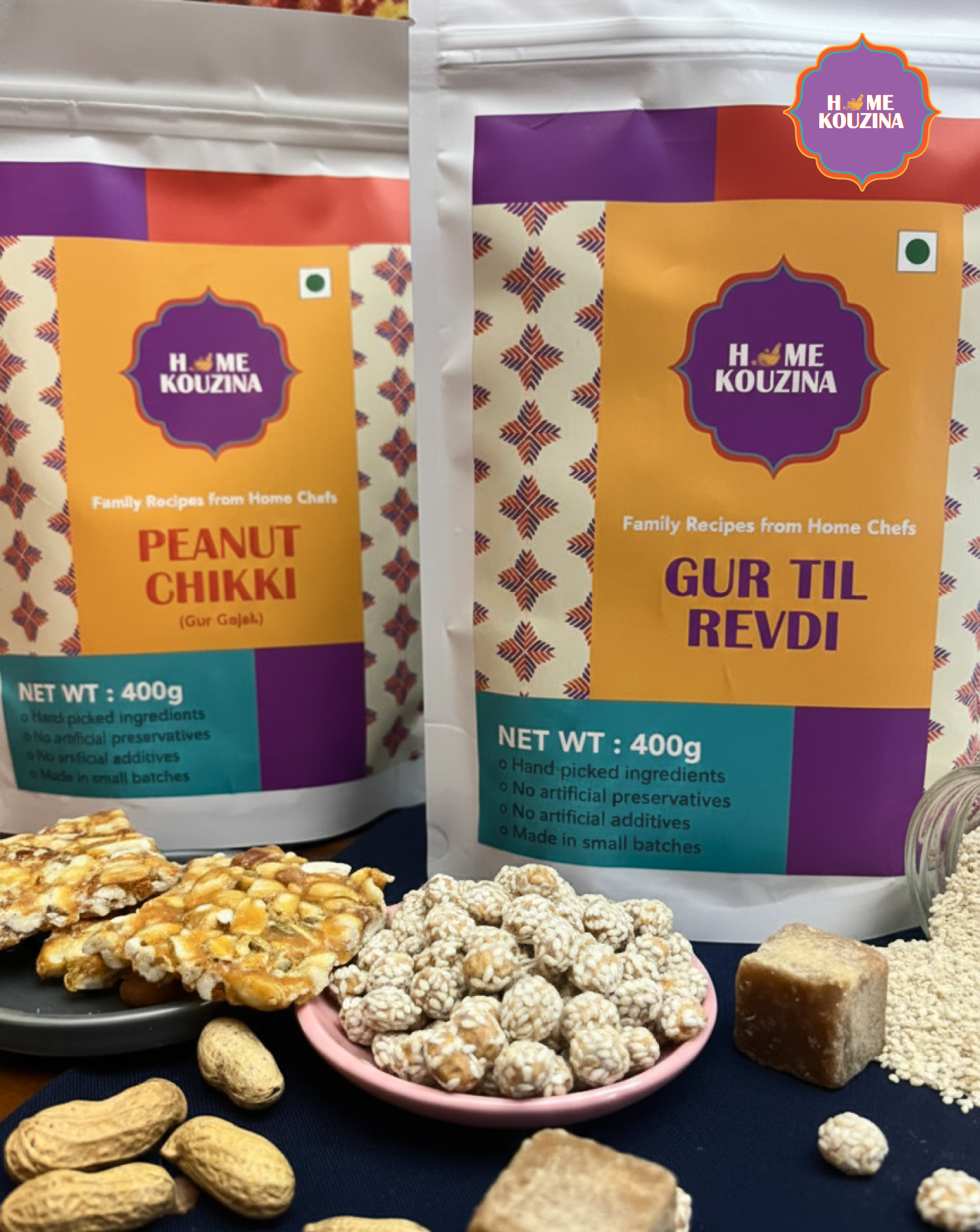 Two packages of Home Kouzina snacks with ingredients and snacks displayed on a table.